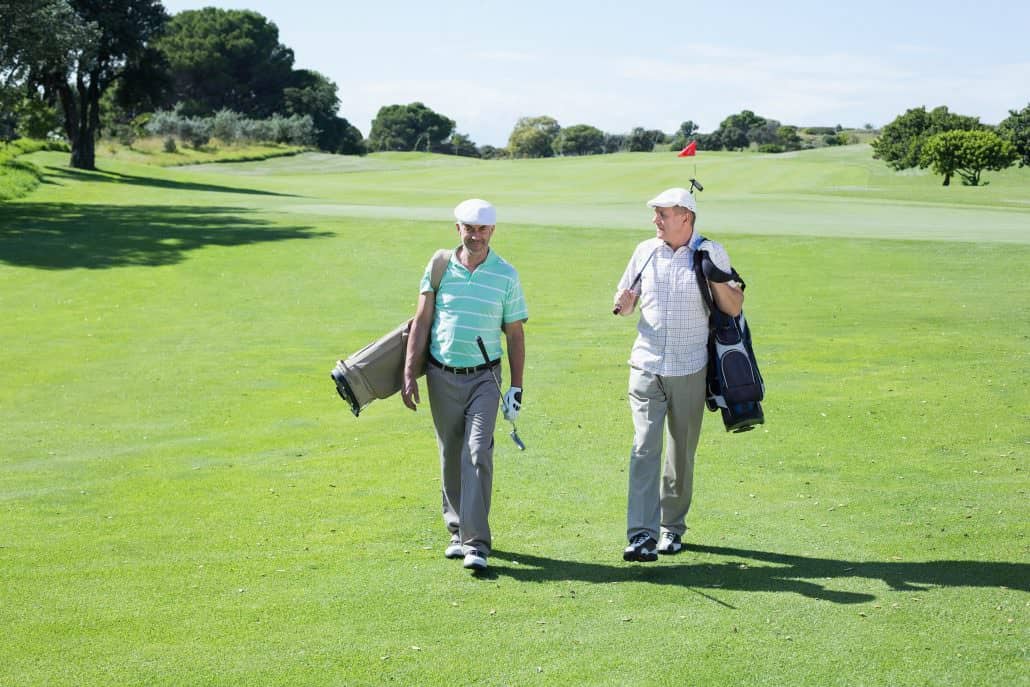 Two men chatting on golf course