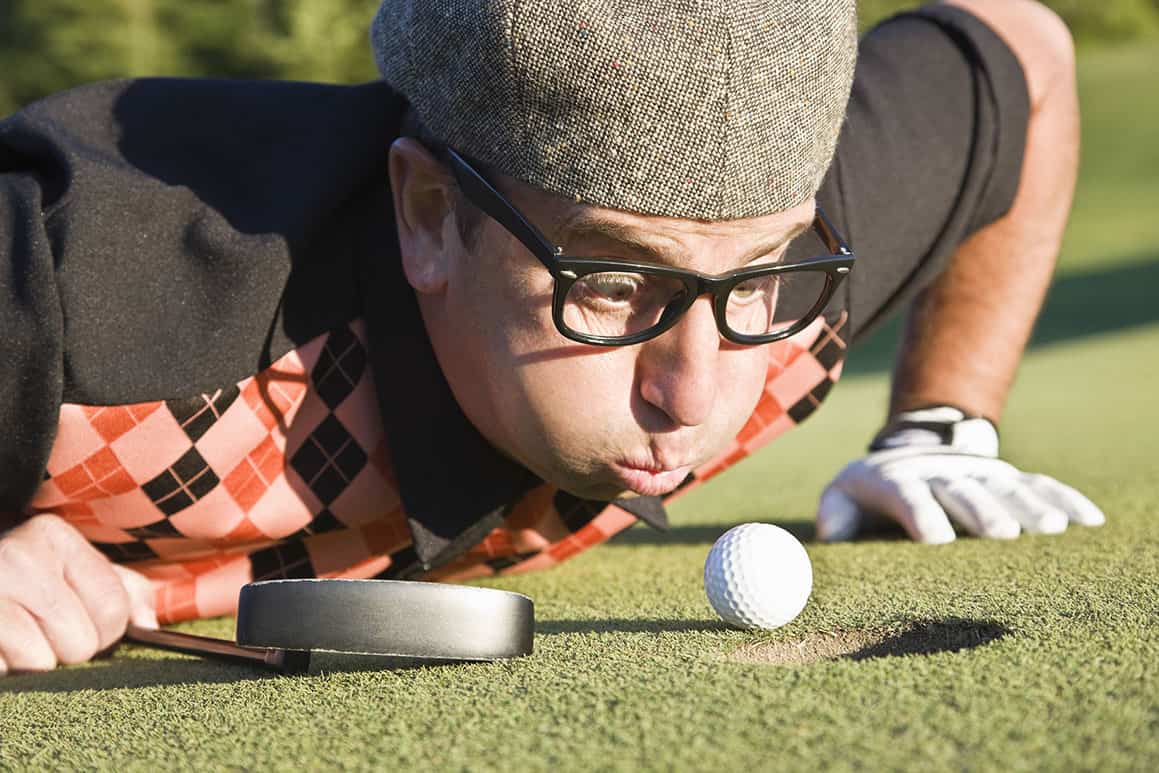 Golf Cheater blowing ball into hole